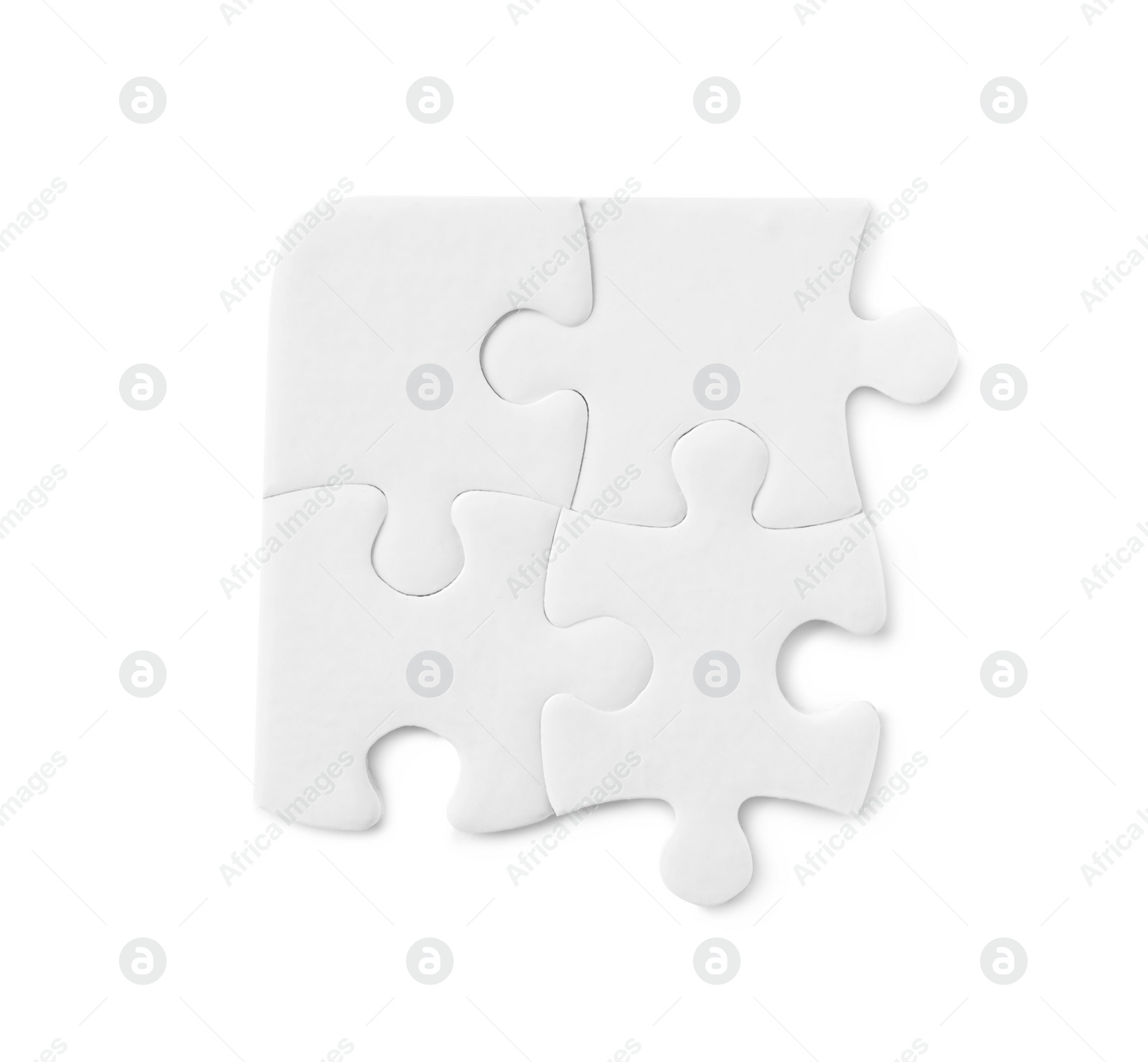 Photo of Blank puzzle pieces isolated on white, top view