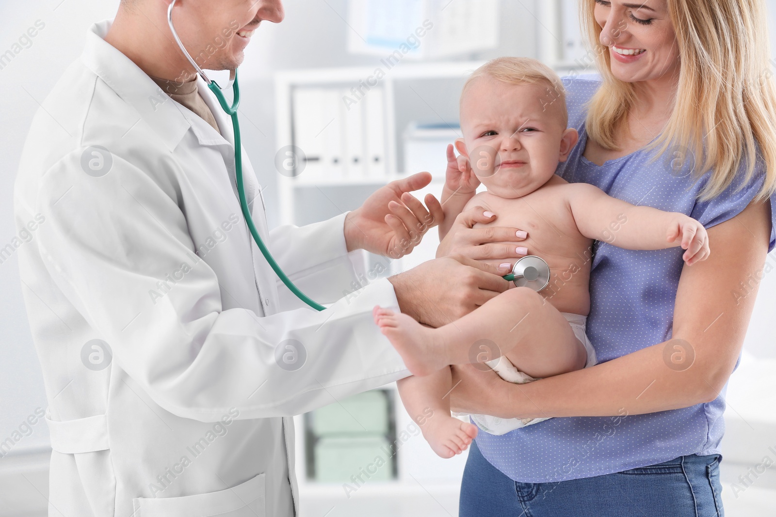 Photo of Woman with her baby visiting children's doctor in hospital