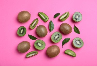 Photo of Flat lay composition with fresh ripe kiwis on pink background