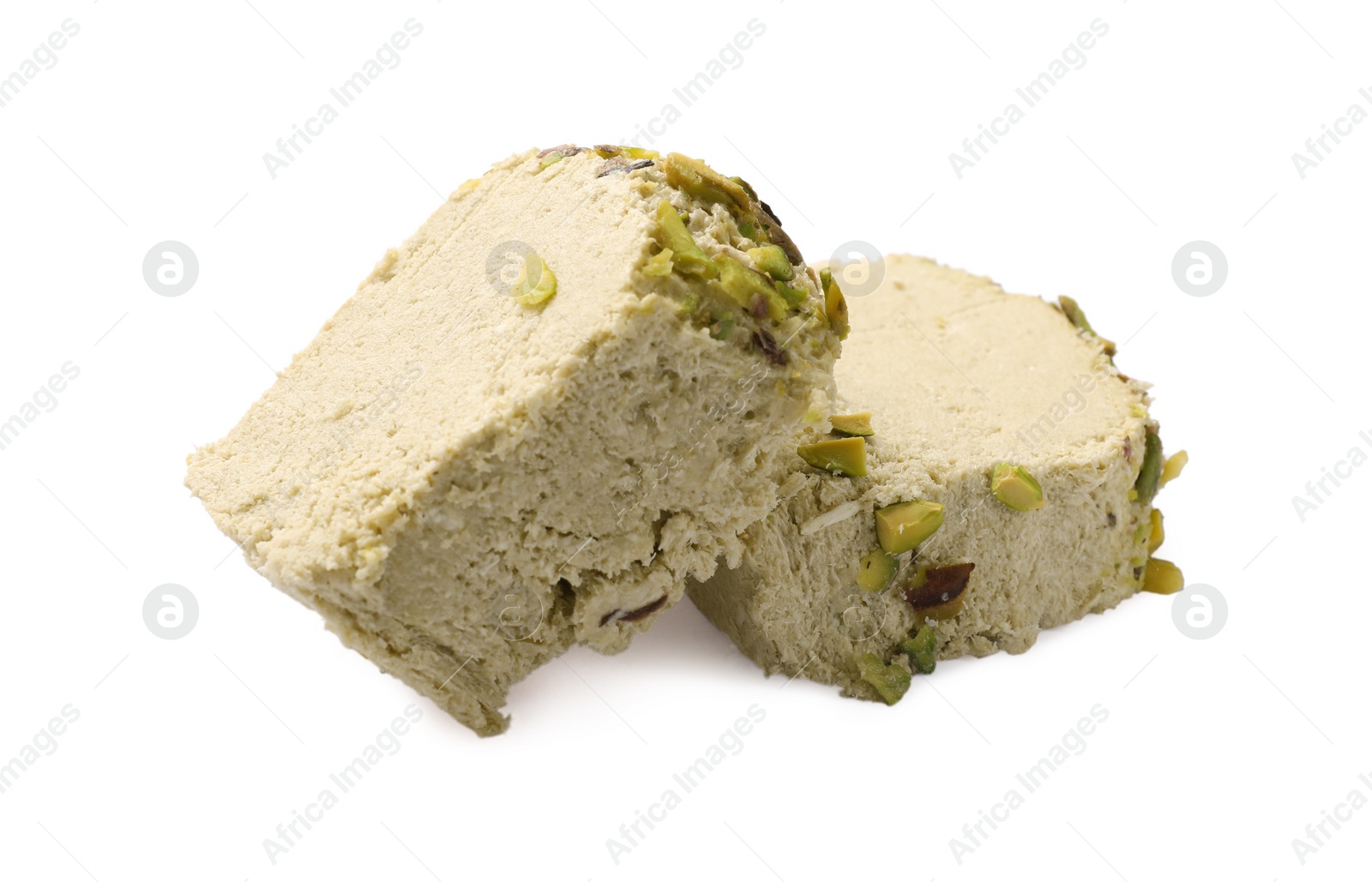 Photo of Pieces of tasty halva with pistachios on white background