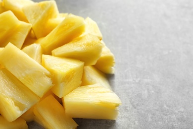 Slices of fresh pineapple on grey background