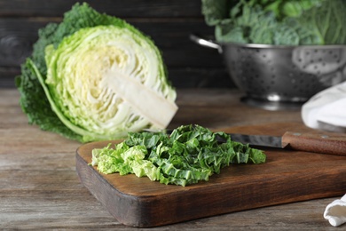 Cut fresh savoy cabbage on wooden table