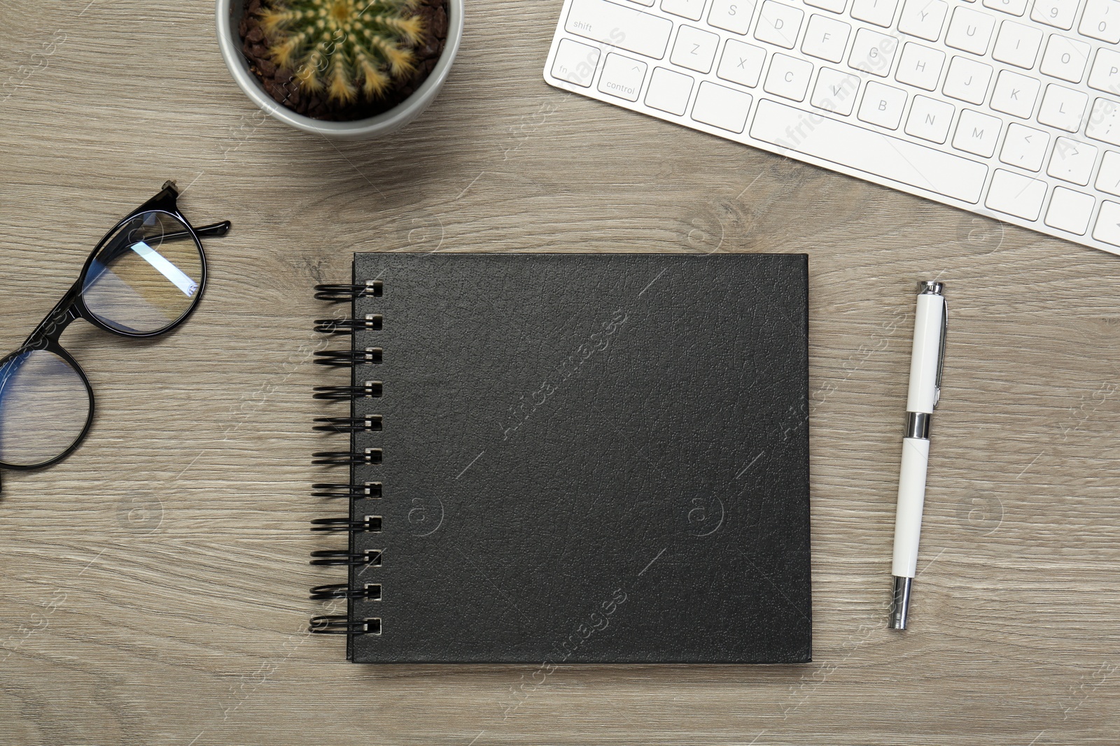 Photo of Flat lay composition with notebook on wooden table