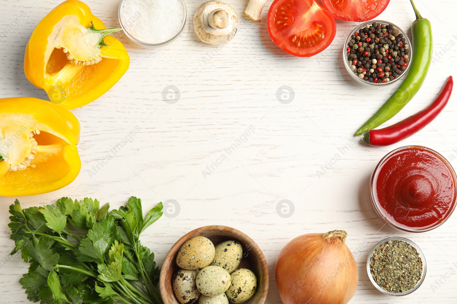 Photo of Frame of ingredients for cooking on white wooden table, flat lay. Space for text