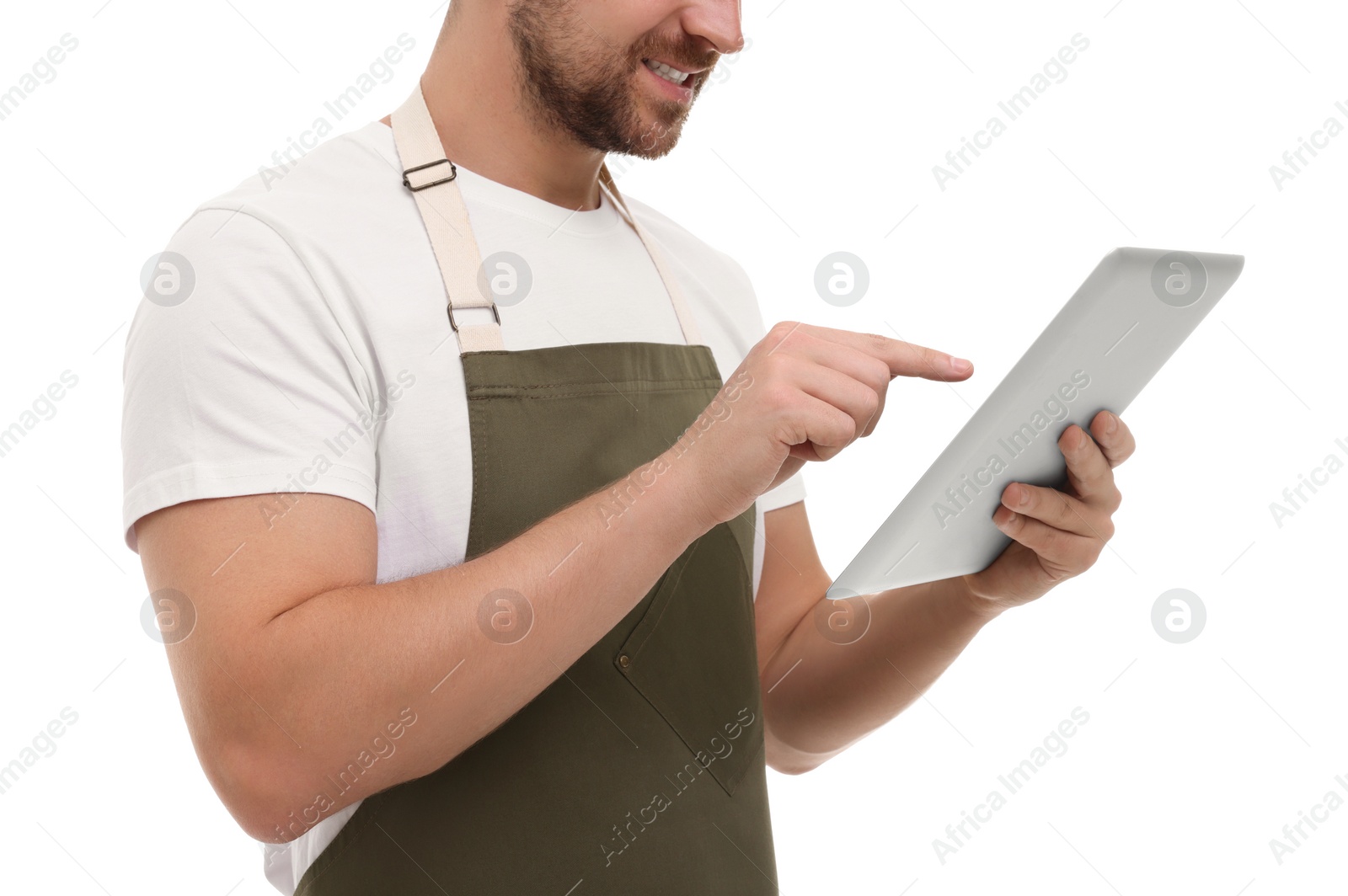 Photo of Smiling man using tablet on white background, closeup