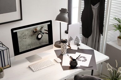 Photo of Stylish workplace with modern computer on desk