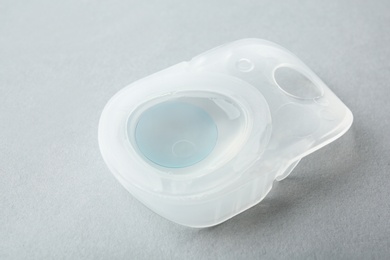 Photo of Package with contact lens on light background