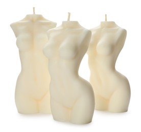 Beautiful female body shaped candles on white background