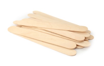 Disposable wooden spatulas for depilatory wax on white background