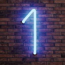 Image of Glowing neon number 1 sign on brick wall