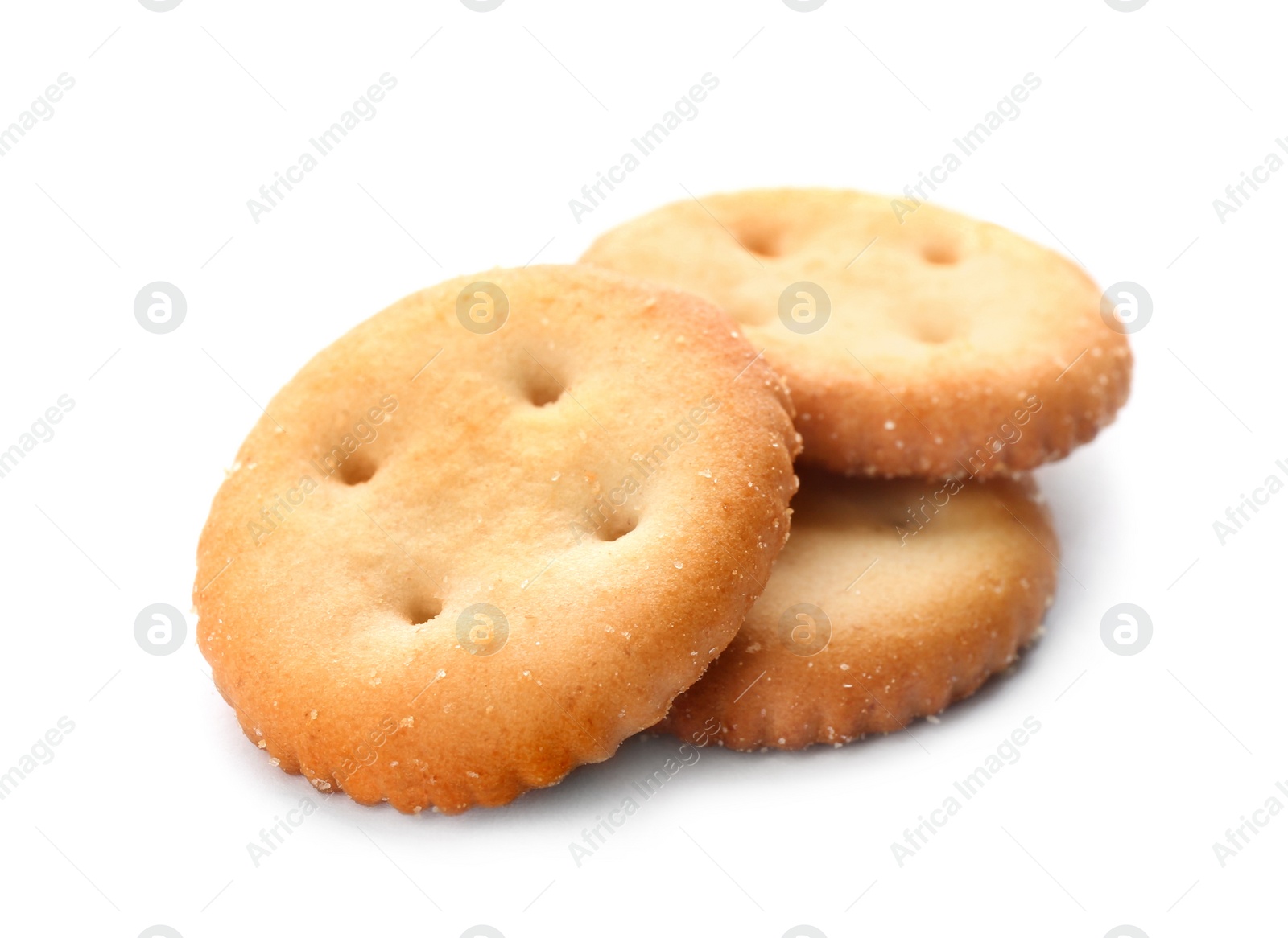 Photo of Crispy crackers isolated on white. Delicious snack