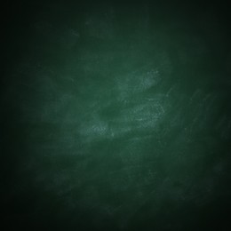 Dirty green chalkboard as background. Vignette effect