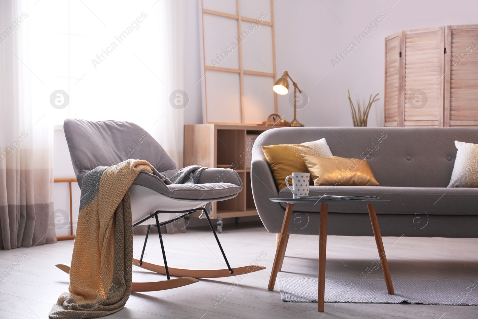 Photo of Stylish living room interior with comfortable sofa. Idea for home decor