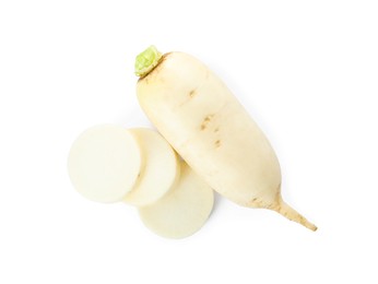 Sliced and whole fresh ripe turnips on white background, top view