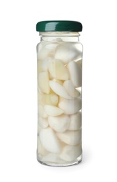 Jar with pickled garlic on white background