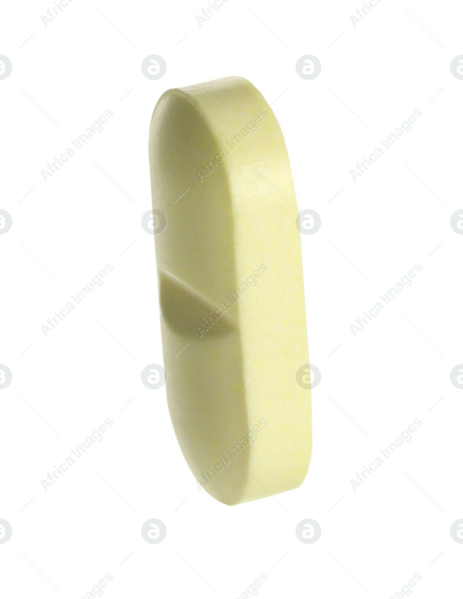 Photo of One light green pill on white background. Medicinal treatment