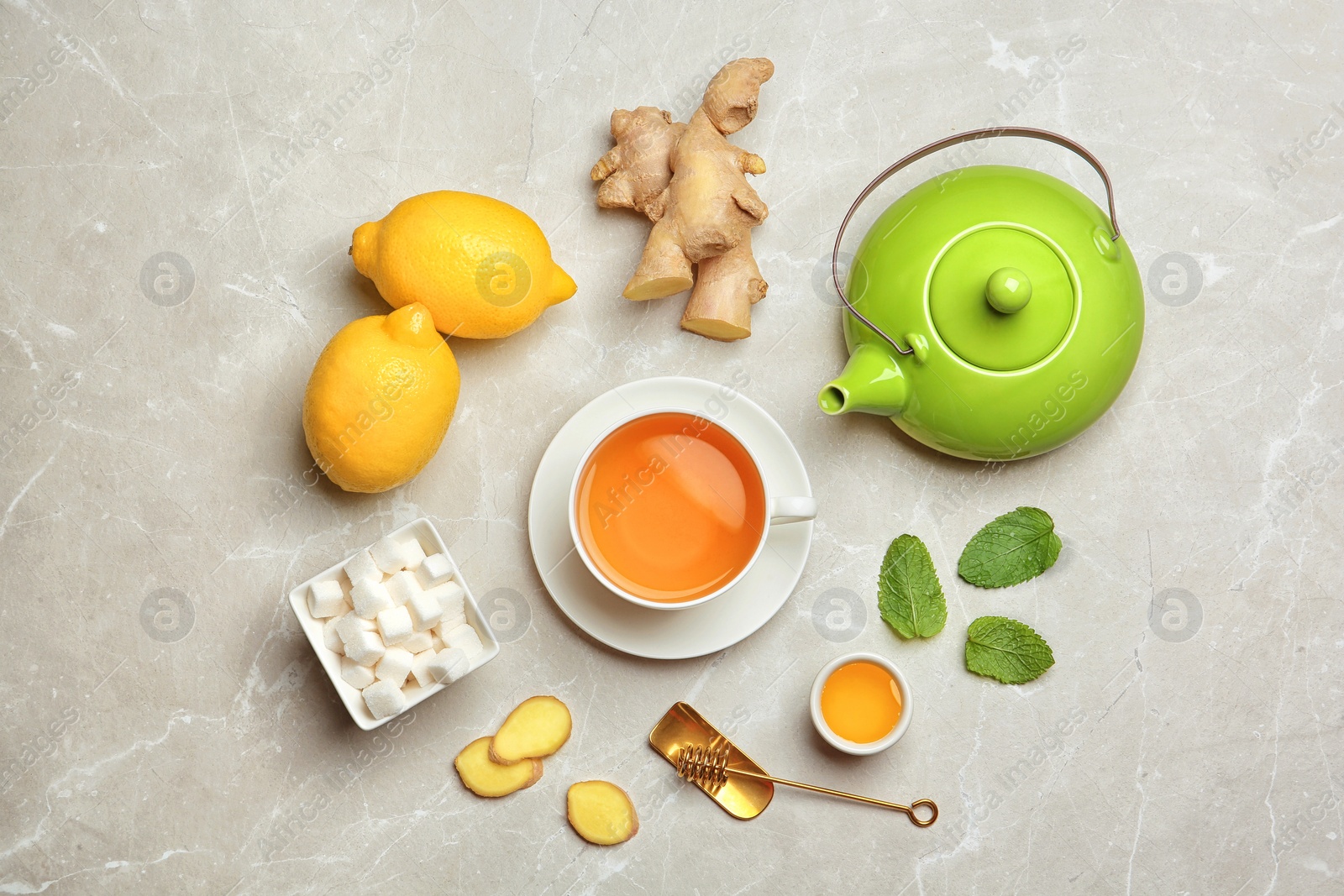 Photo of Composition with lemon tea on table, top view