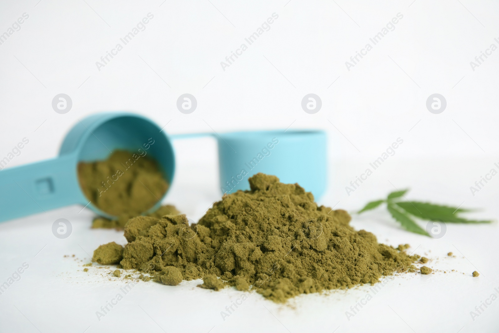 Photo of Pile of hemp protein powder on white table