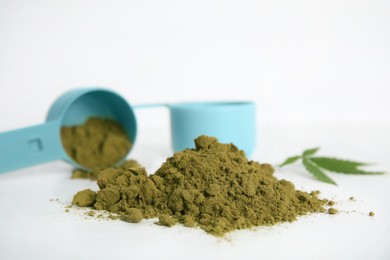 Pile of hemp protein powder on white table