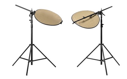 Image of Tripods with reflectors on white background. Professional photographer's equipment