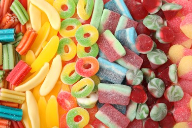 Photo of Tasty colorful jelly candies as background, top view