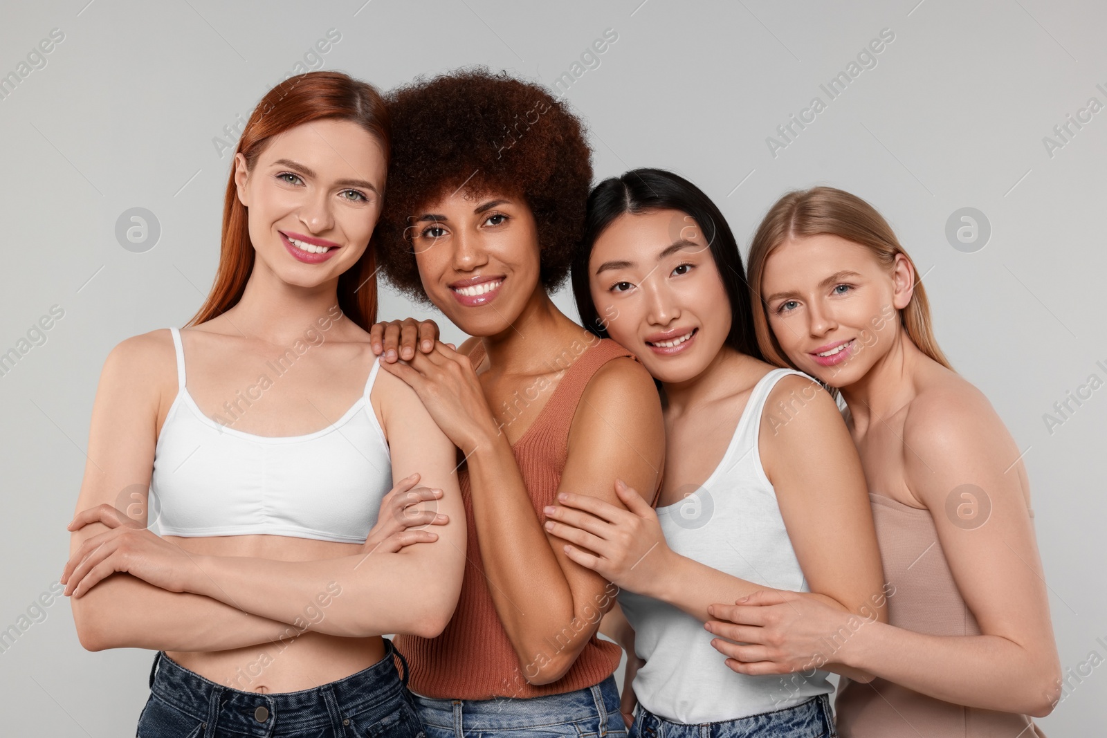 Photo of Portrait of beautiful young women on light grey background