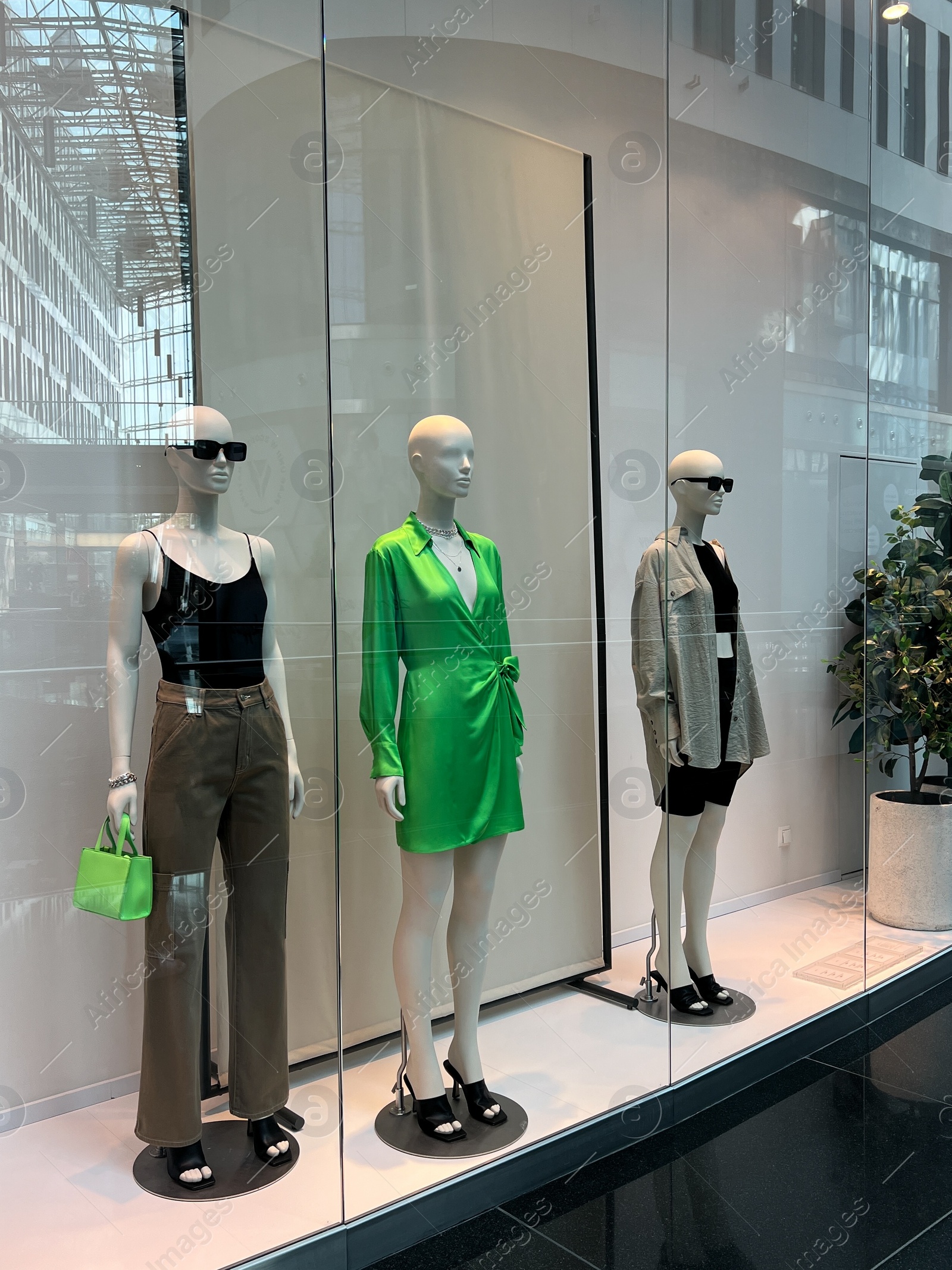 Photo of WARSAW, POLAND - JULY 23, 2022: Fashion store showcase with mannequins in shopping mall