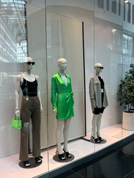 WARSAW, POLAND - JULY 23, 2022: Fashion store showcase with mannequins in shopping mall