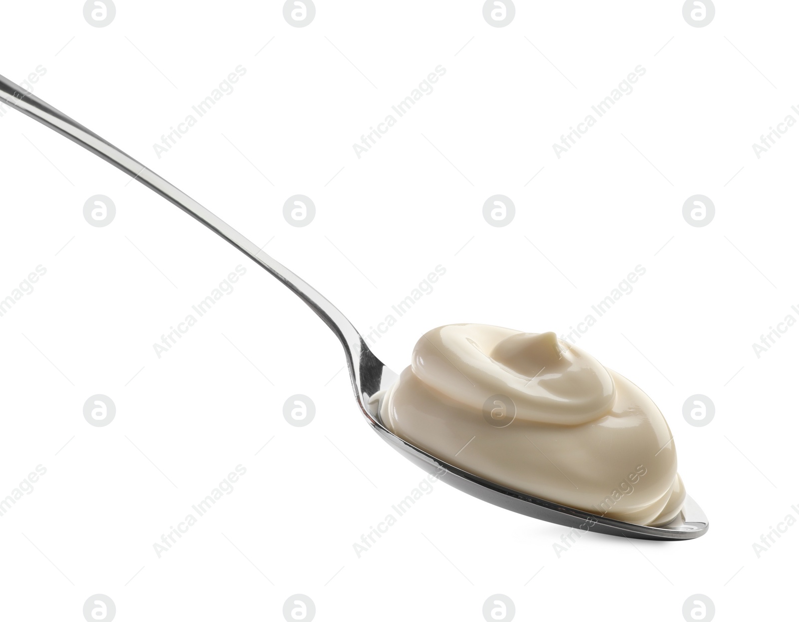 Photo of Natural yogurt in spoon isolated on white