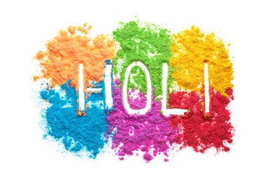 Photo of Word Holi and colorful powder dyes on white background, top view