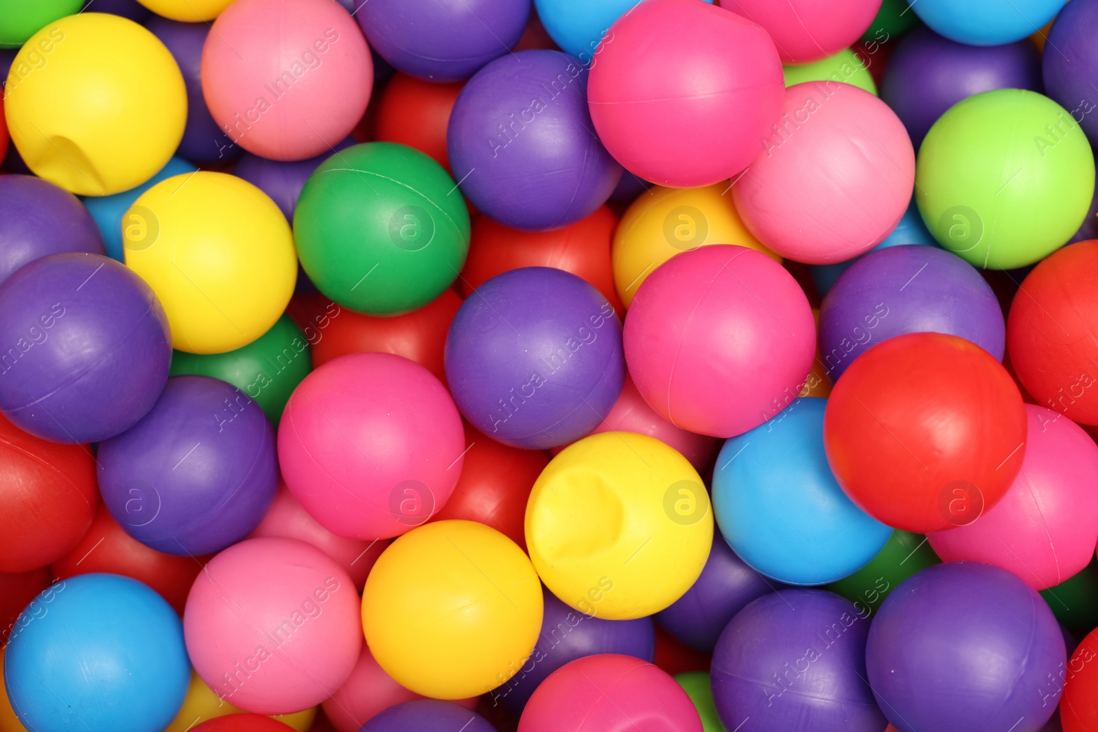 Photo of Many colorful balls as background, top view