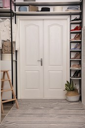 Closet interior with storage rack for shoes, clothes and accessories