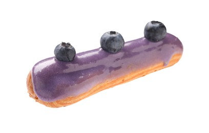 Photo of Delicious eclair decorated with blueberries isolated on white