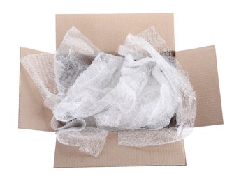Photo of Transparent bubble wrap in cardboard box isolated on white, top view