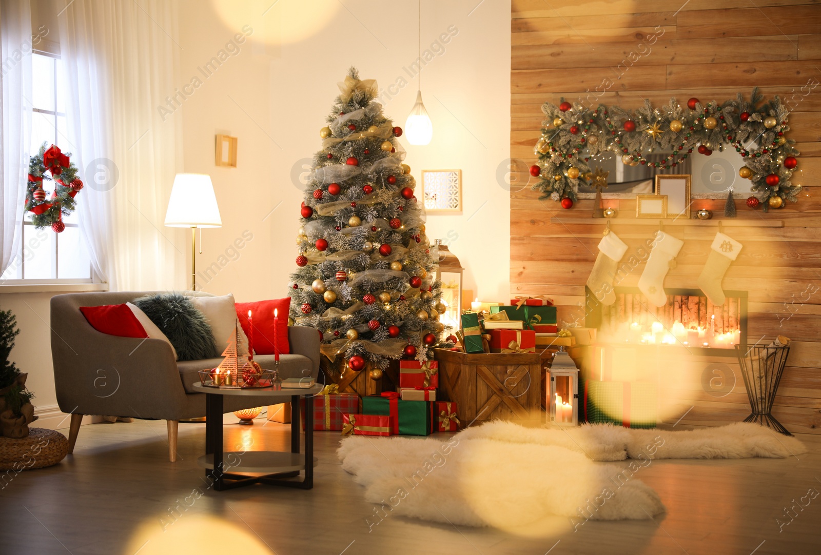 Image of Beautiful Christmas tree in living room, bokeh effect. Festive interior