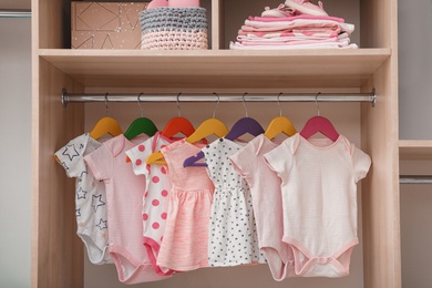 Photo of Wardrobe with cute baby clothes and home stuff