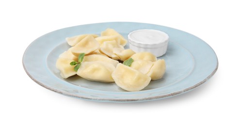 Photo of Plate of delicious dumplings (varenyky) with cottage cheese, mint and sour cream isolated on white