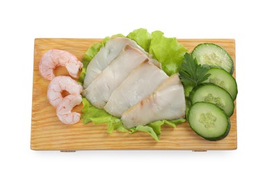 Photo of Sashimi set (raw slices of oily fish and shrimps) served with cucumber, lettuce and parsley isolated on white, top view