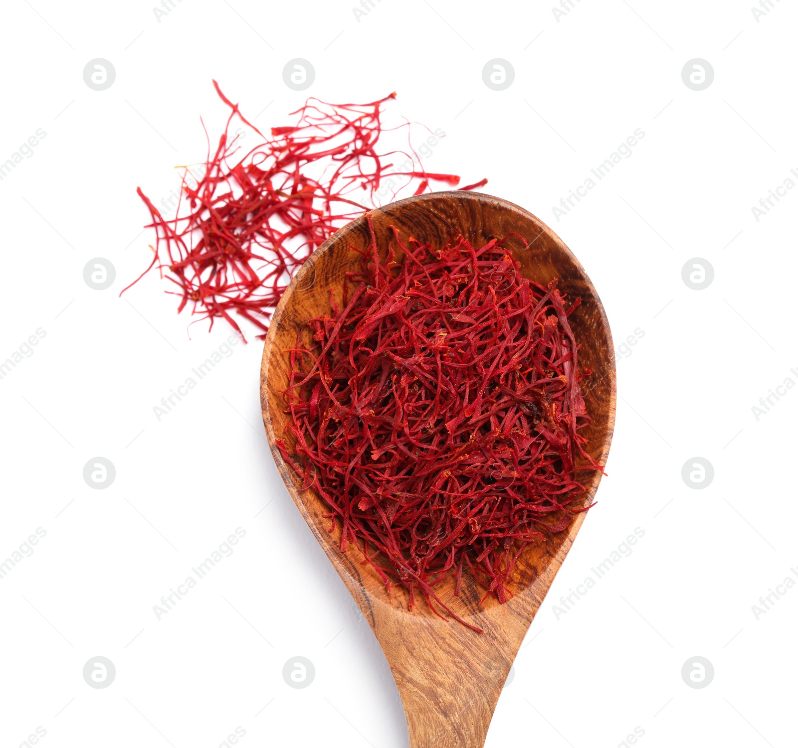 Photo of Aromatic saffron and spoon isolated on white, top view