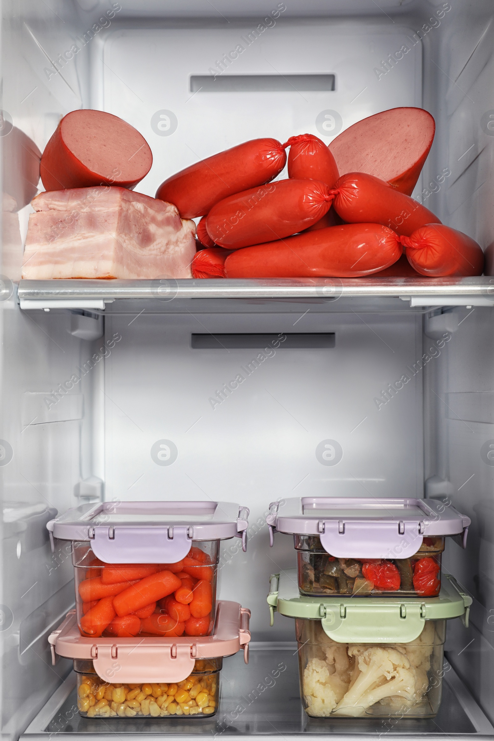 Photo of Open refrigerator full of different fresh products
