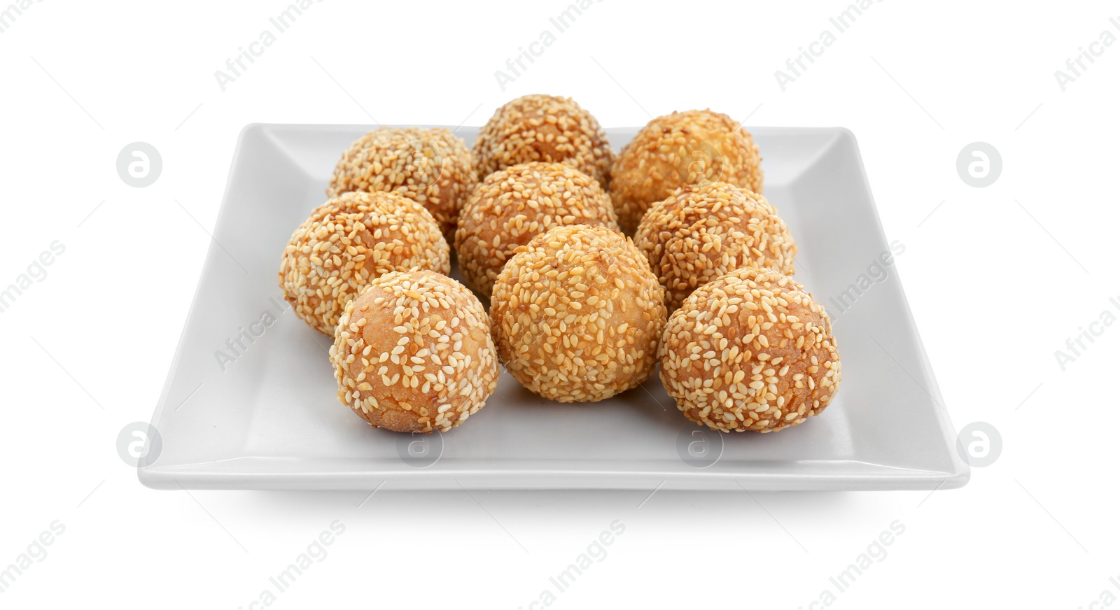 Photo of Plate of delicious sesame balls on white background