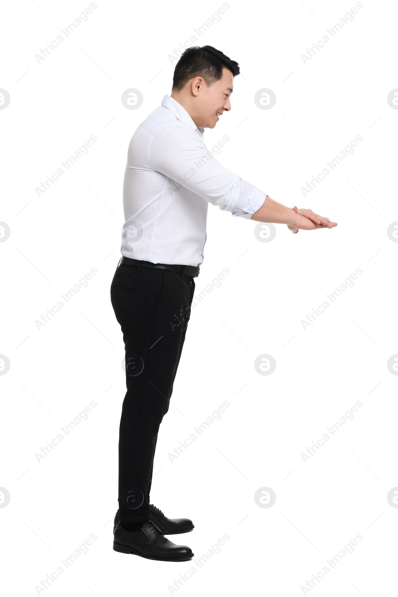 Photo of Businessman in formal clothes posing on white background