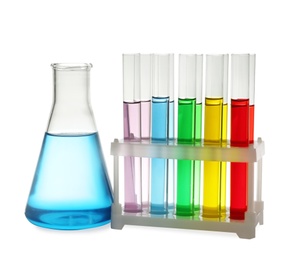 Photo of Laboratory glassware with colorful liquids on white background