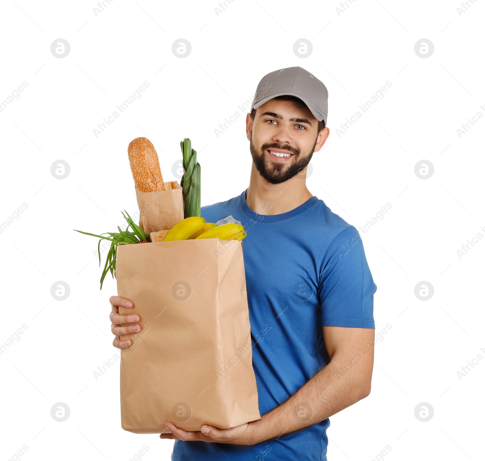 Photo of Man holding paper bag with fresh products on white background. Food delivery service