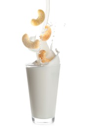 Image of Delicious cashew milk and nuts on white background