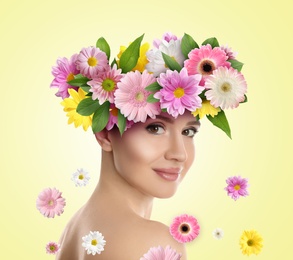 Image of Pretty woman wearing beautiful wreath made of flowers on light yellow background