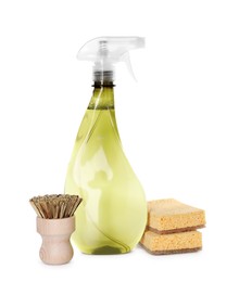 Spray bottle of cleaning product, brush and sponges isolated on white