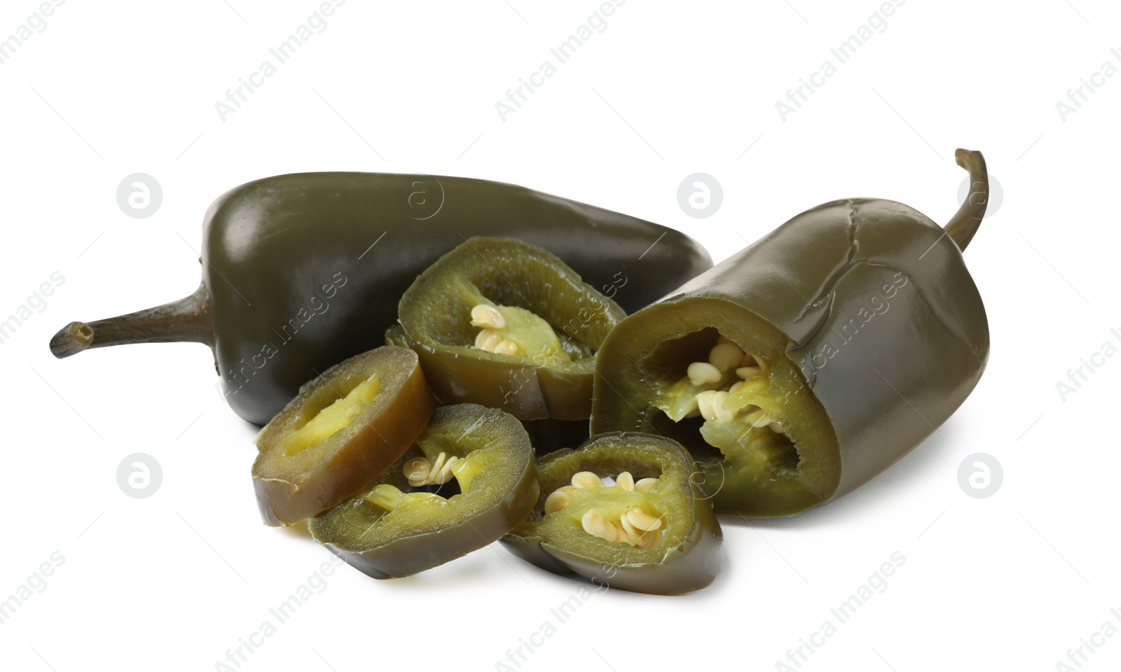 Photo of Whole and cut pickled green jalapenos on white background