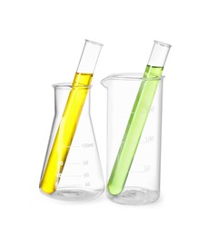 Photo of Glass flask, beaker and test tubes with colorful liquids isolated on white