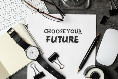 Photo of Flat lay composition with phrase CHOOSE YOUR FUTURE on grey stone background